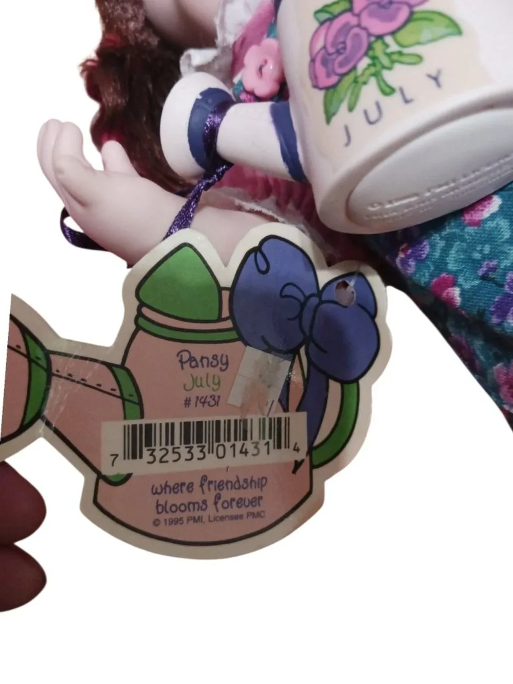 Precious Moments–style collectible doll a July month Pansy gardening doll 